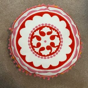 colorful round pillow. small spot on back